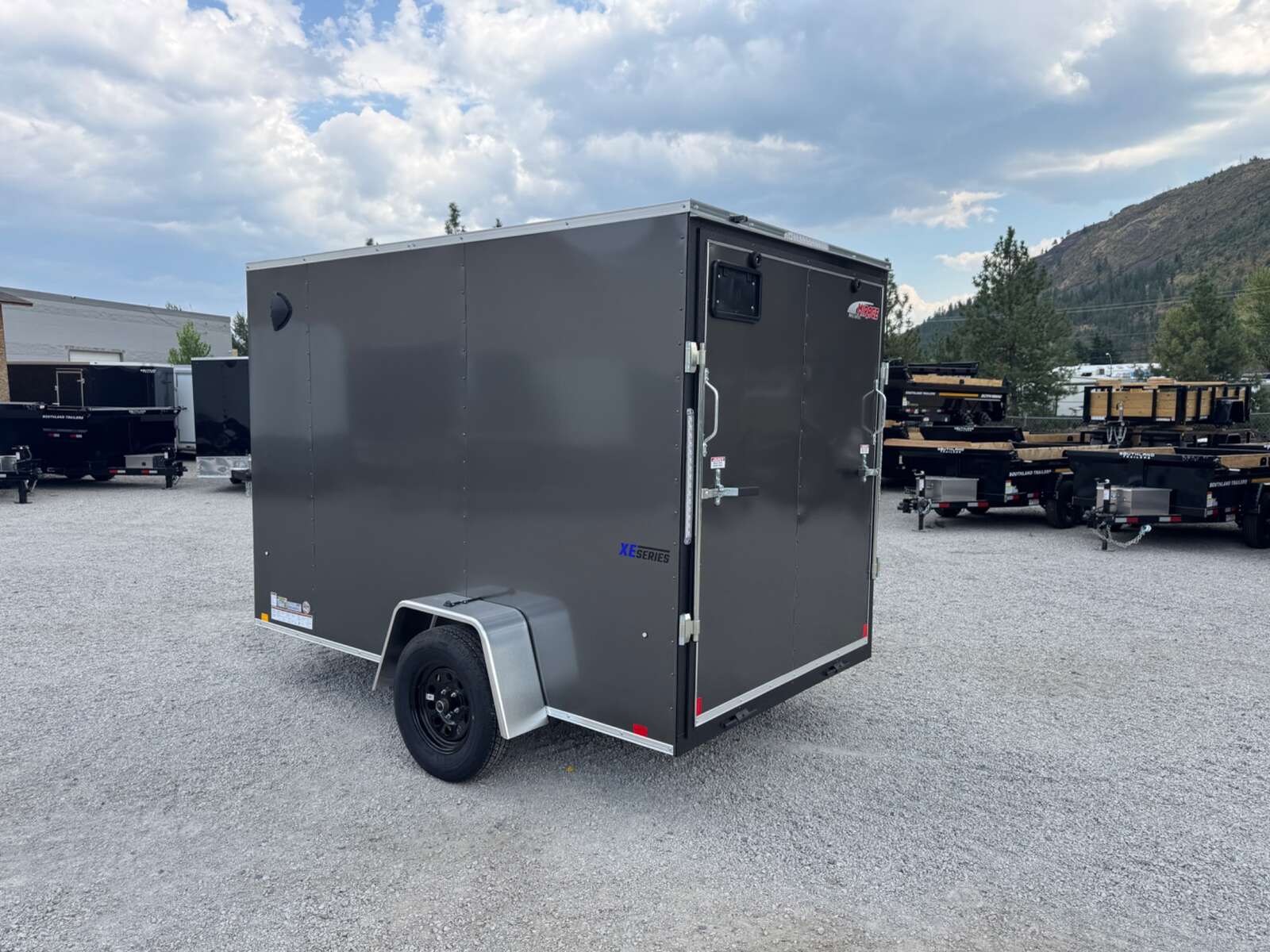 Photo of 2026 Mirage XE 6x10 V Nose Enclosed Cargo Trailer Ramp Door Charcoal Grey Extra Height 2990lb GVW