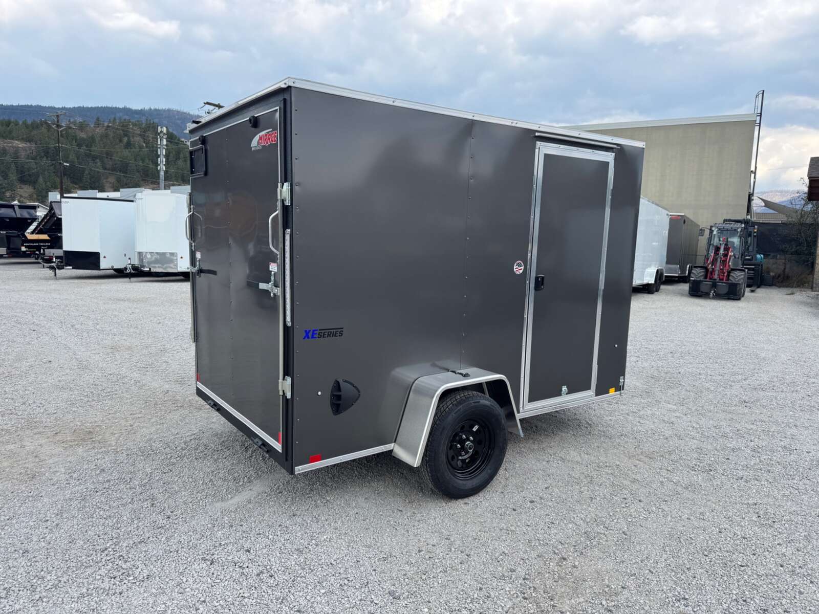 Photo of 2026 Mirage XE 6x10 V Nose Enclosed Cargo Trailer Ramp Door Charcoal Grey Extra Height 2990lb GVW