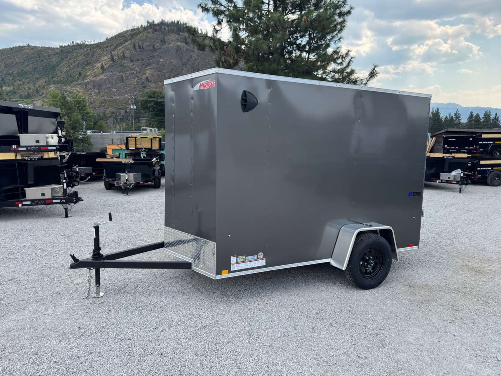 Photo of 2026 Mirage XE 6x10 V Nose Enclosed Cargo Trailer Ramp Door Charcoal Grey Extra Height 2990lb GVW