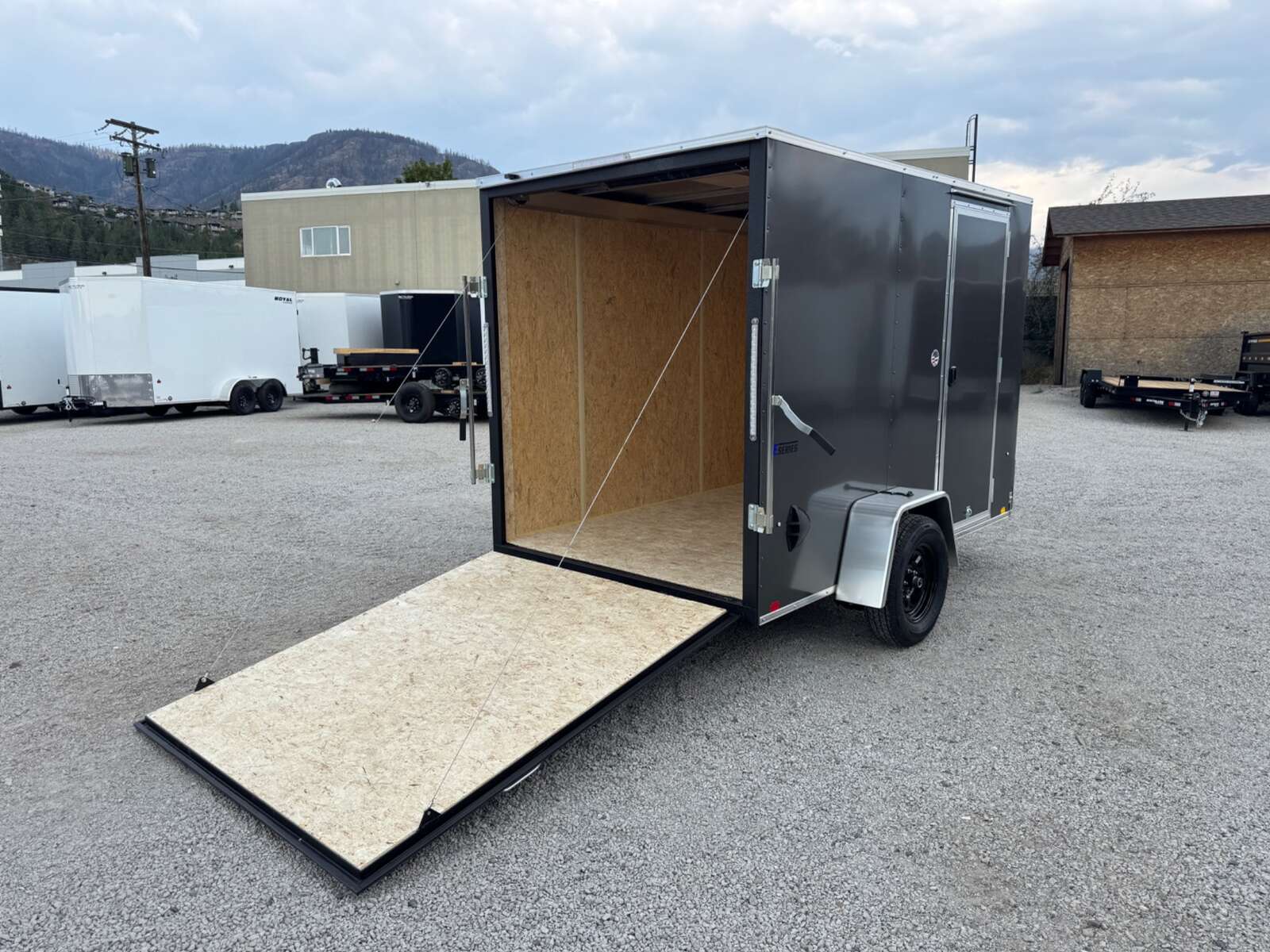 Photo of 2026 Mirage XE 6x10 V Nose Enclosed Cargo Trailer Ramp Door Charcoal Grey Extra Height 2990lb GVW