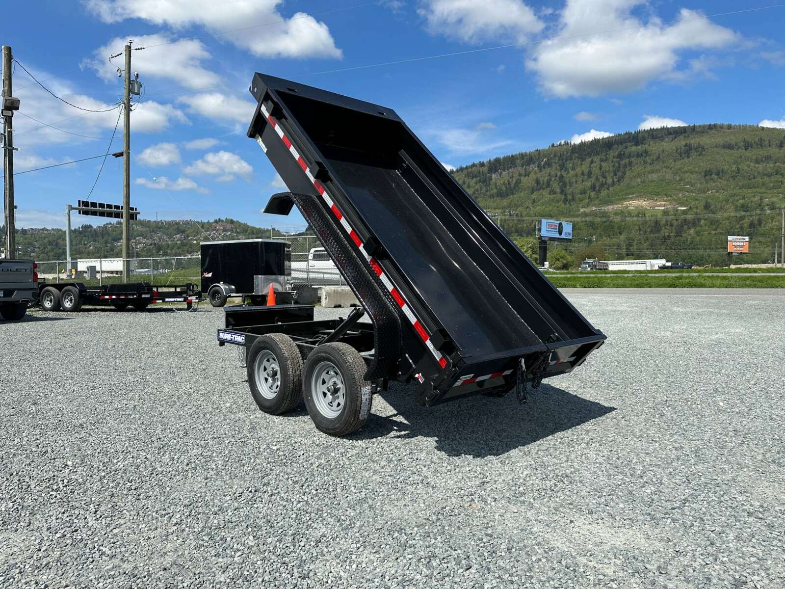 Photo of 2025 Suretrac 5x10 Dump Trailer 7000lb GVW Barn Doors