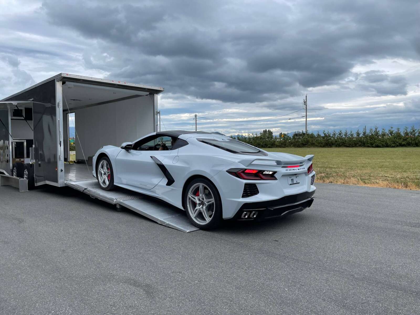Photo of 2026 ALCOM ALUMINUM 8.5x24 CAR TRAILER 9900lb GVW WHITE LARGE ESCAPE SIDE DOOR CARGO ENCLOSED