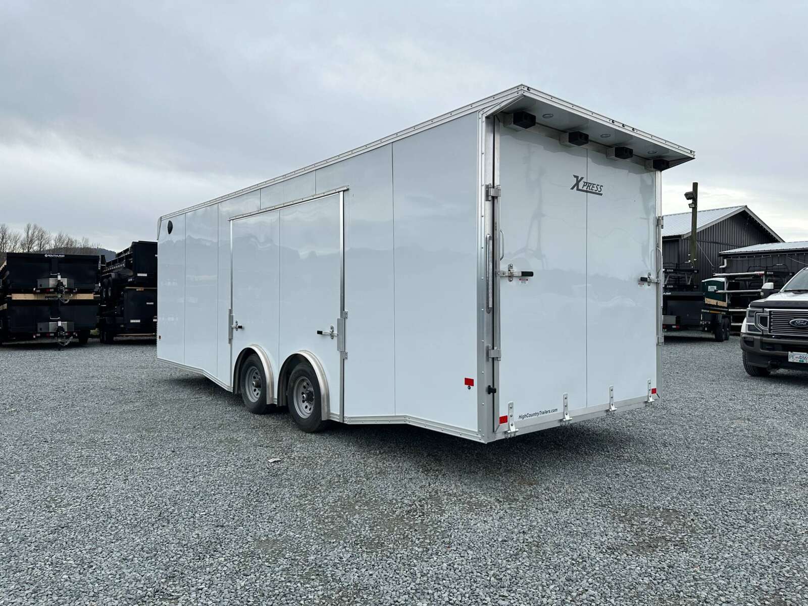 Photo of 2026 ALCOM ALUMINUM 8.5x24 CAR TRAILER 9900lb GVW WHITE LARGE ESCAPE SIDE DOOR CARGO ENCLOSED