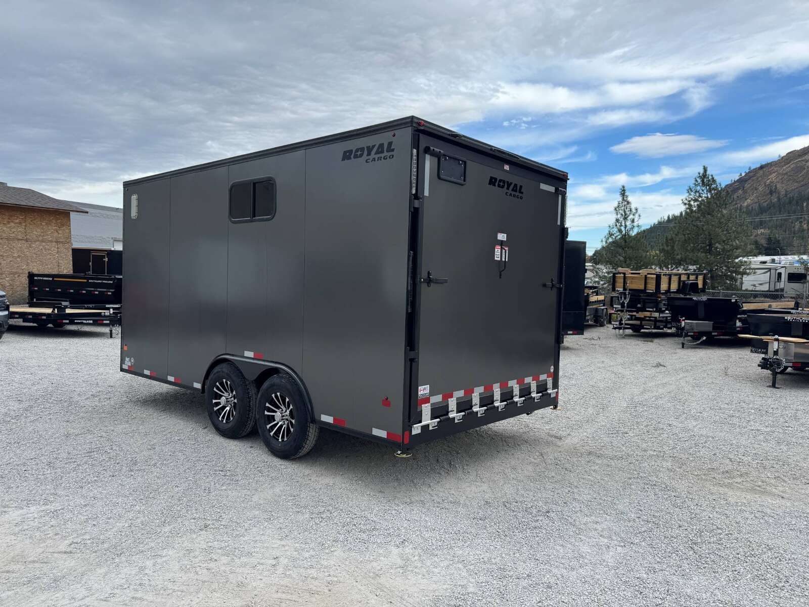 Photo of 2026 Royal 8.5x16 V Nose Cargo Enclosed Trailer Camping Package Charcoal Grey w/ Blackout Pkg, Insulated, Ramp Door, White Walls, 2x Windows & More!