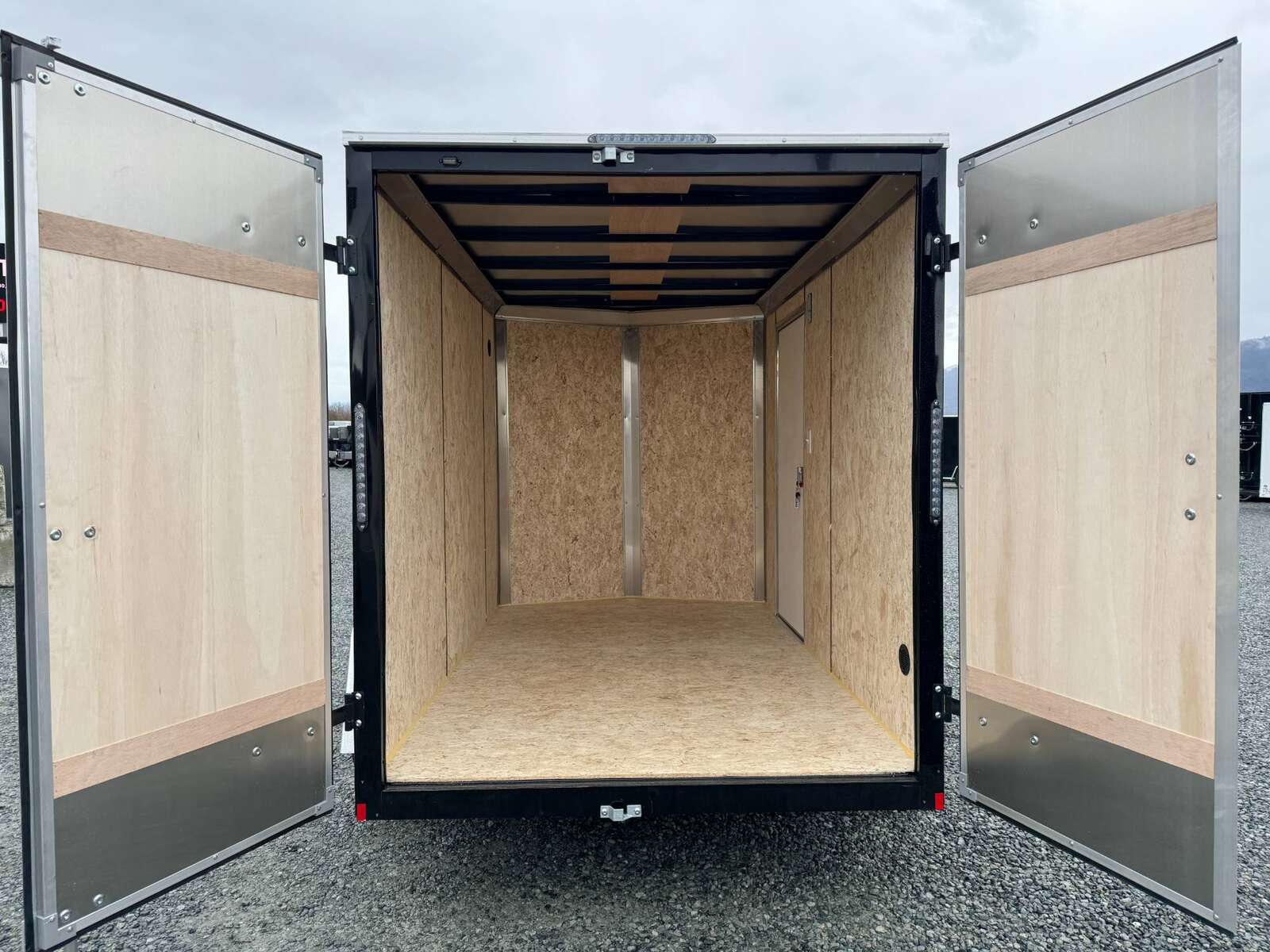 Photo of 2026 Mirage XE 6x10 V Nose Enclosed Cargo Trailer Barn Doors Black Extra Height 2990lb GVW
