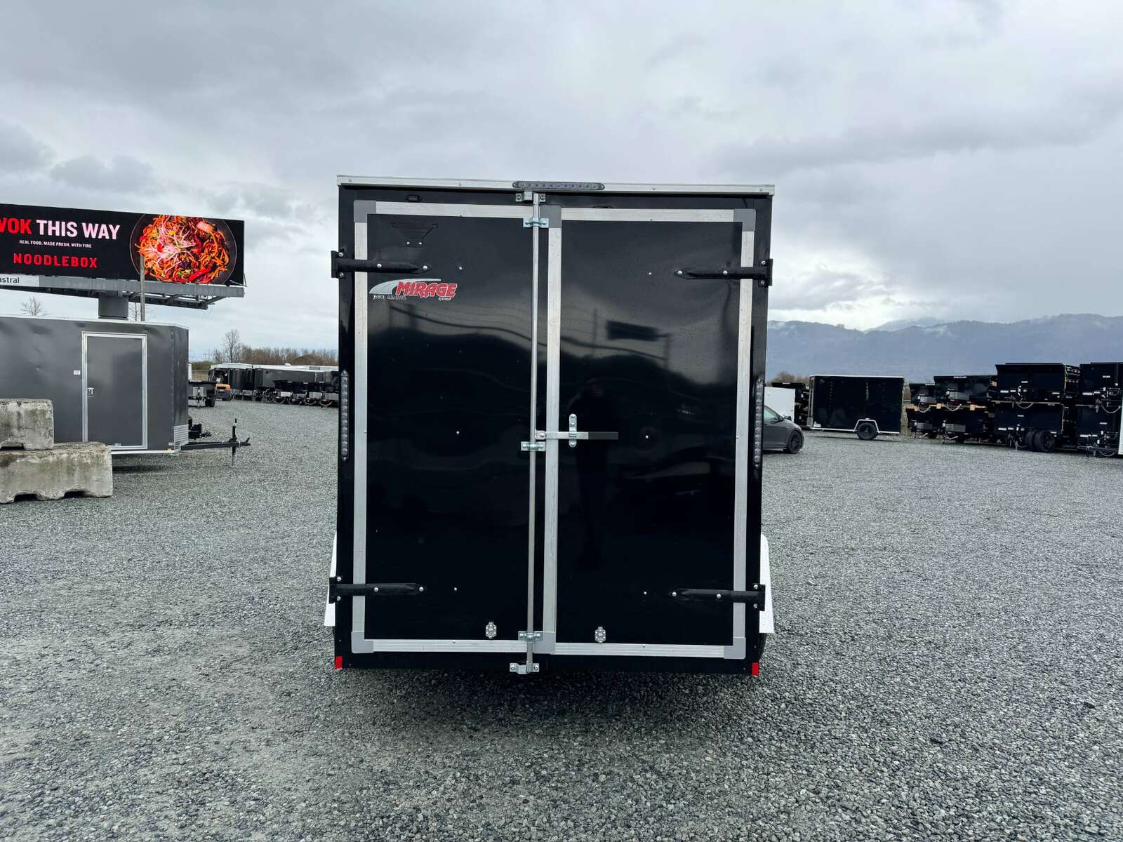 Photo of 2026 Mirage XE 6x10 V Nose Enclosed Cargo Trailer Barn Doors Black Extra Height 2990lb GVW