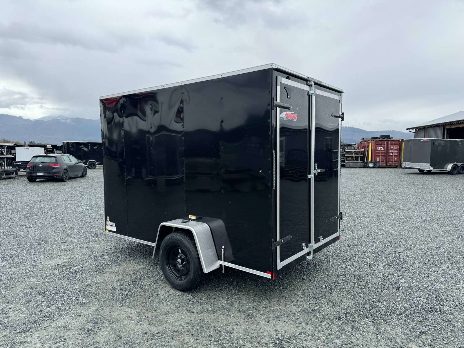 Photo of 2026 Mirage XE 6x10 V Nose Enclosed Cargo Trailer Barn Doors Black Extra Height 2990lb GVW