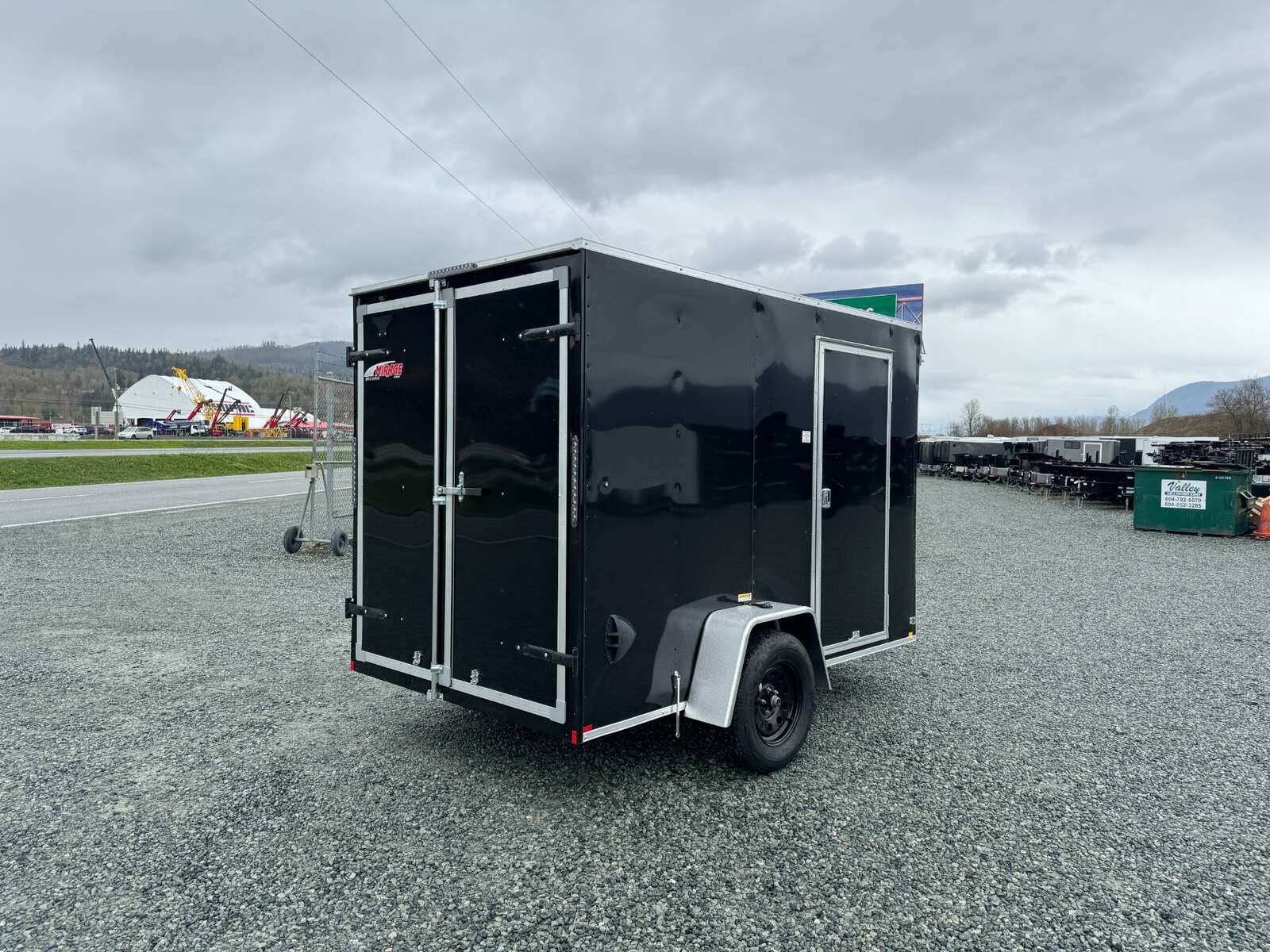 Photo of 2026 Mirage XE 6x10 V Nose Enclosed Cargo Trailer Barn Doors Black Extra Height 2990lb GVW