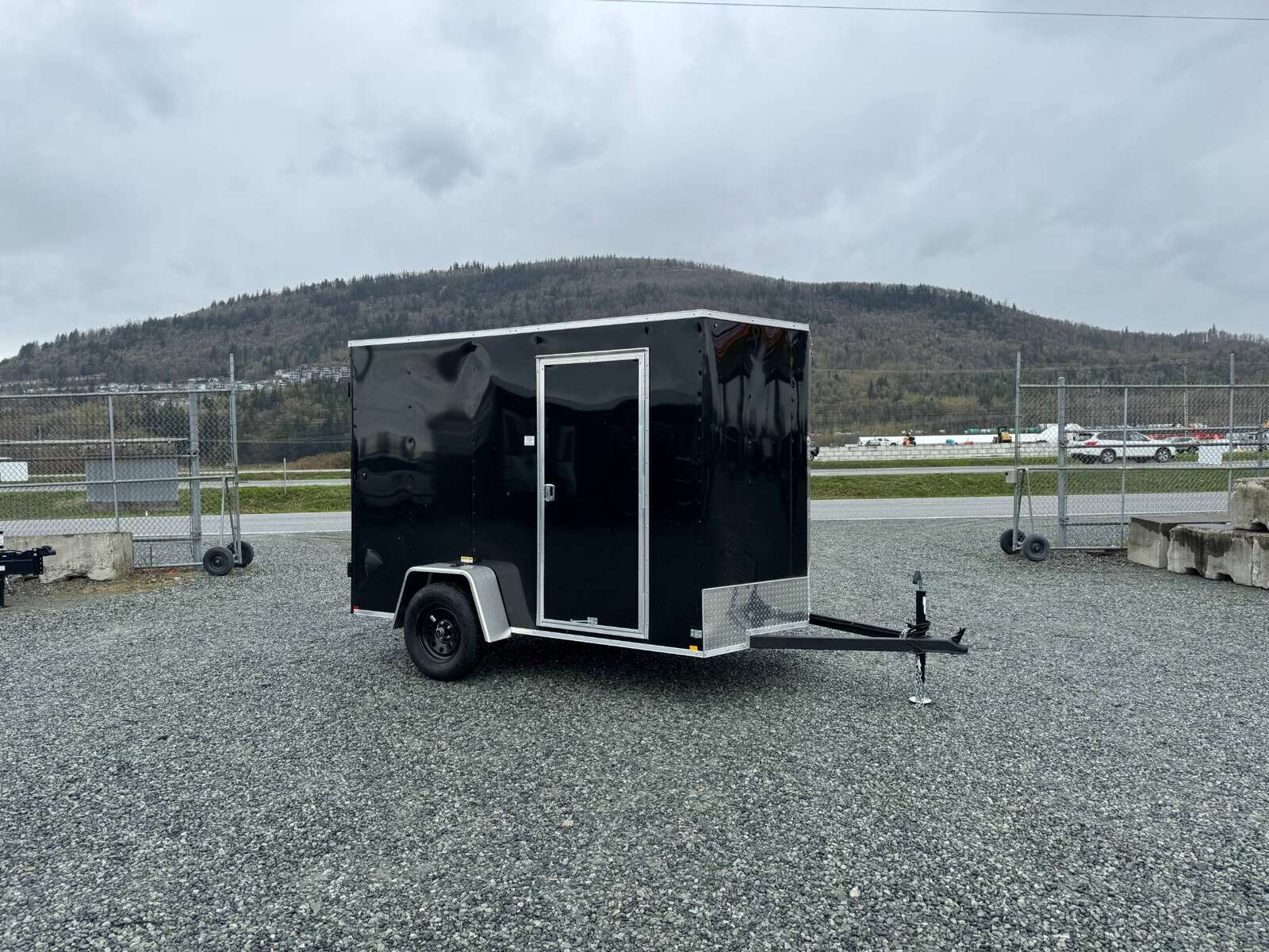 Photo of 2026 Mirage XE 6x10 V Nose Enclosed Cargo Trailer Barn Doors Black Extra Height 2990lb GVW