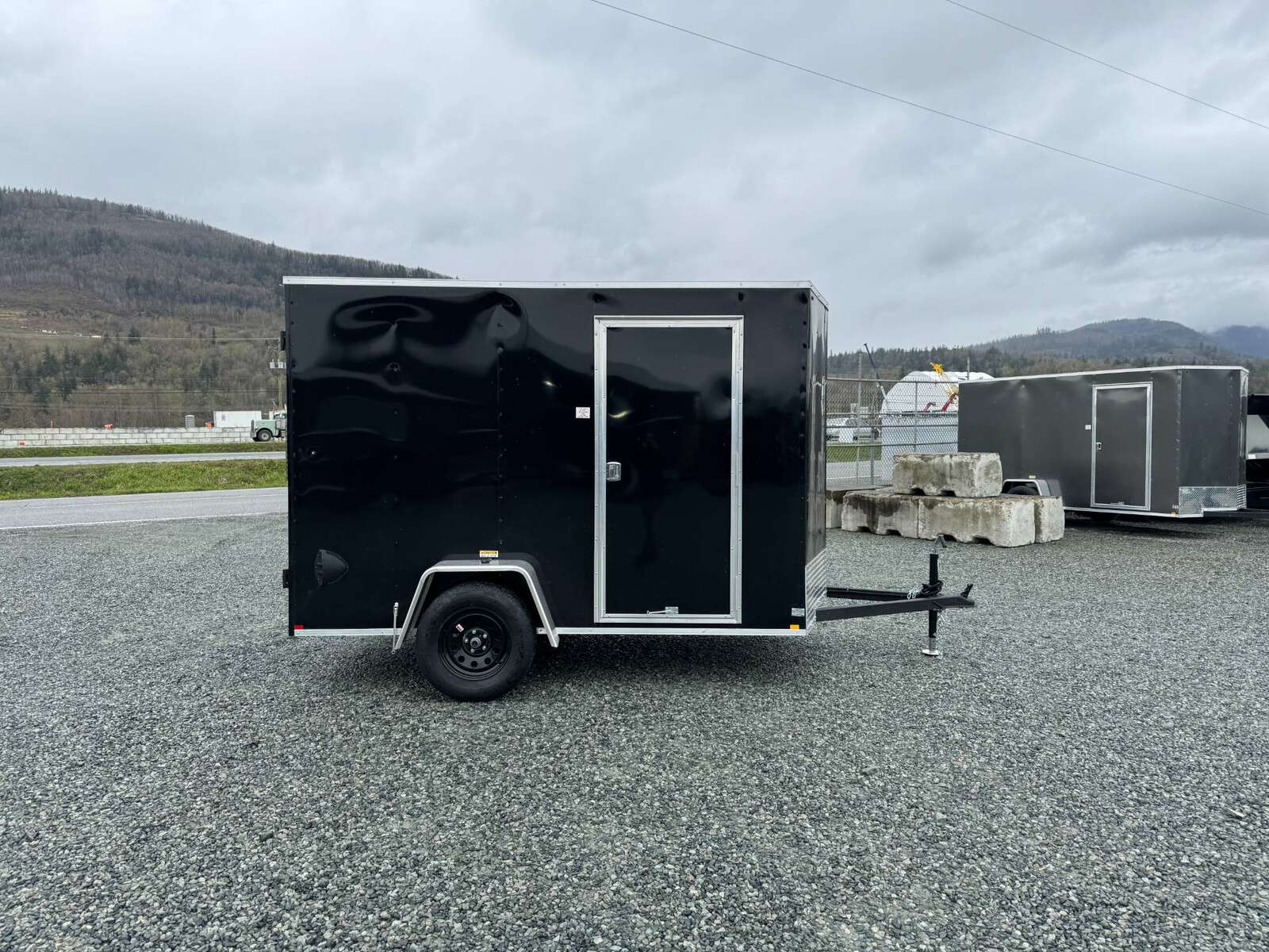 Photo of 2026 Mirage XE 6x10 V Nose Enclosed Cargo Trailer Barn Doors Black Extra Height 2990lb GVW