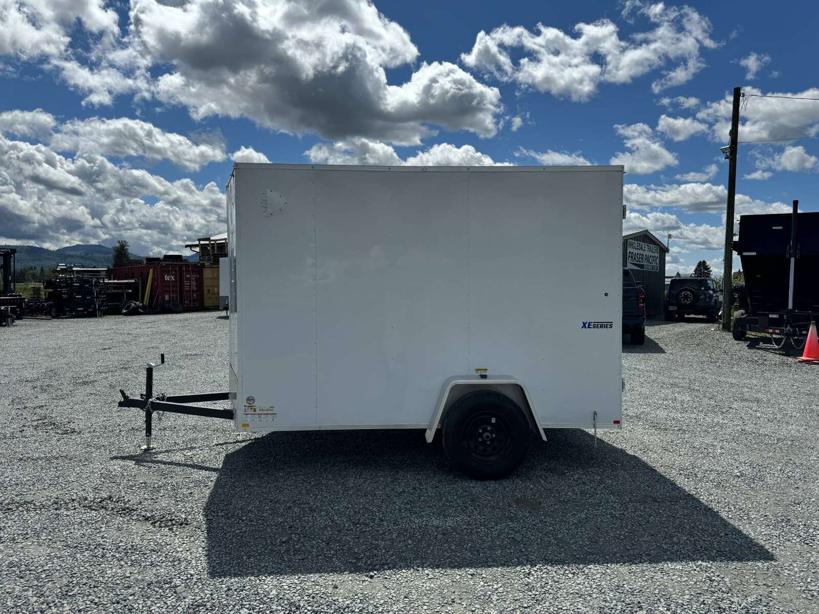 Photo of 2026 Mirage XE 6x10 V Nose Enclosed Cargo Trailer Barn Doors White Extra Height 2990lb GVW