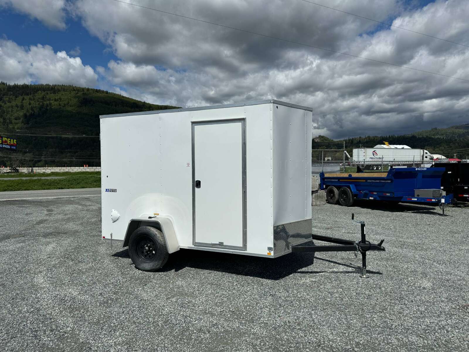 Photo of 2026 Mirage XE 6x10 V Nose Enclosed Cargo Trailer Barn Doors White Extra Height 2990lb GVW