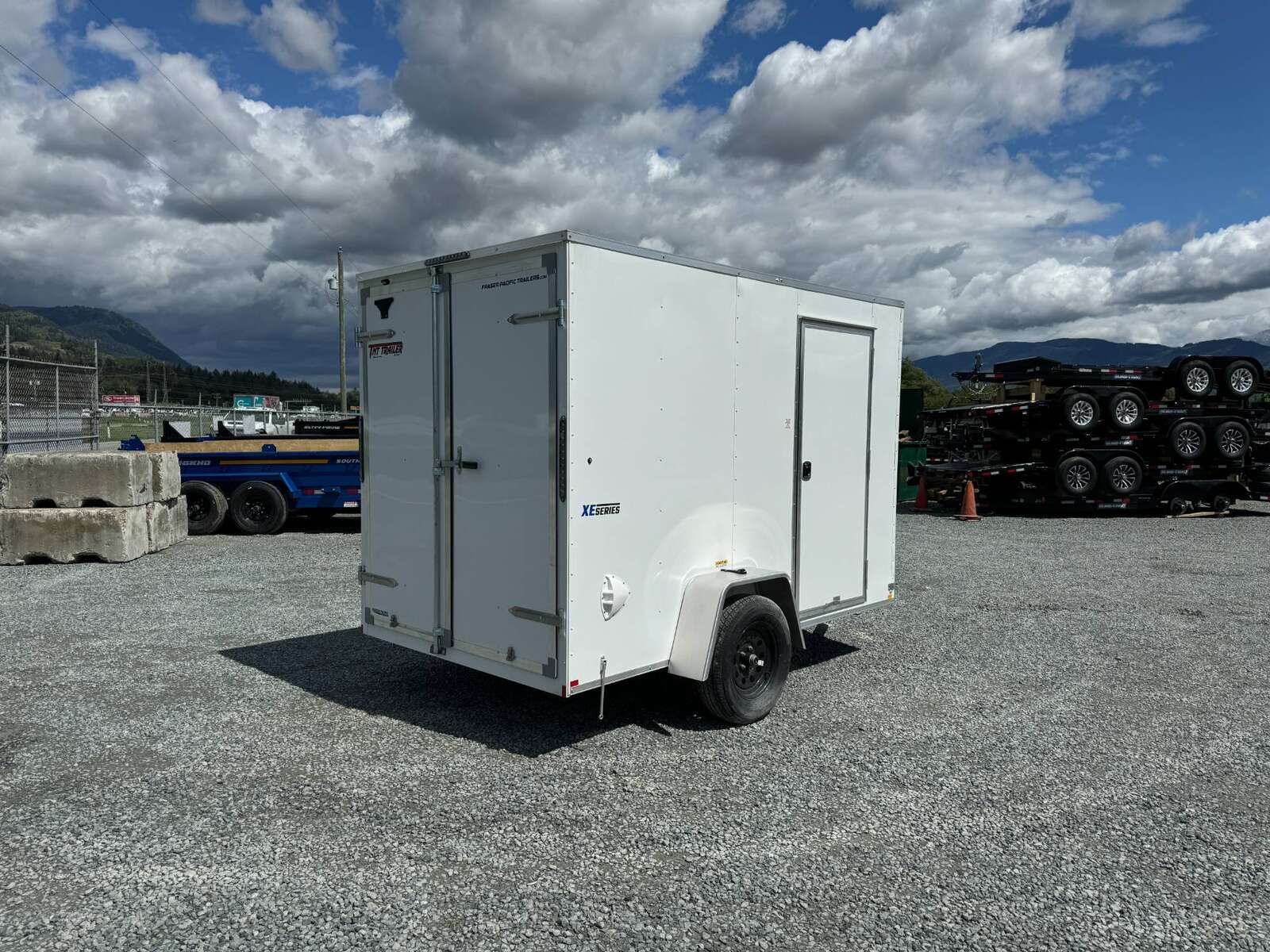 Photo of 2026 Mirage XE 6x10 V Nose Enclosed Cargo Trailer Barn Doors White Extra Height 2990lb GVW
