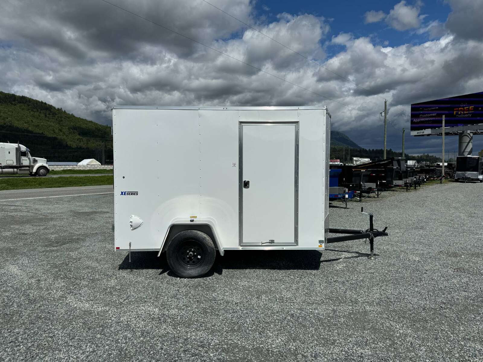 Photo of 2026 Mirage XE 6x10 V Nose Enclosed Cargo Trailer Barn Doors White Extra Height 2990lb GVW