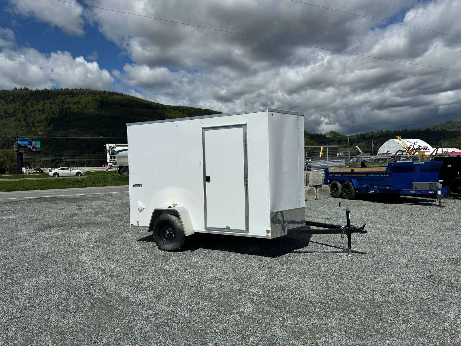 Photo of 2026 Mirage XE 6x10 V Nose Enclosed Cargo Trailer Barn Doors White Extra Height 2990lb GVW
