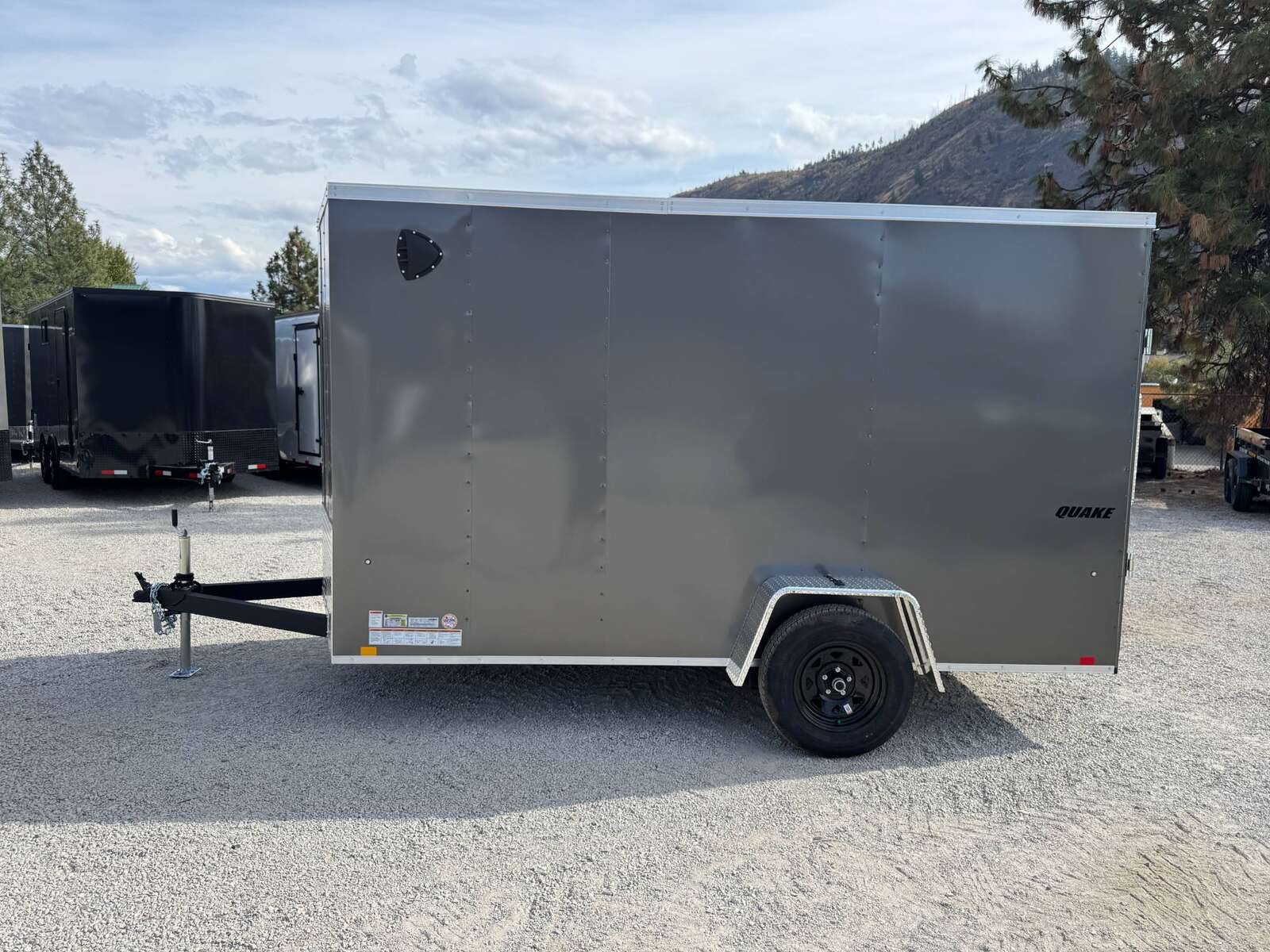 Photo of 2026 Impact Quake 6x12 V Nose Cargo / Enclosed Trailer Charcoal Grey Ramp Door Extra Height 2990lb GVW