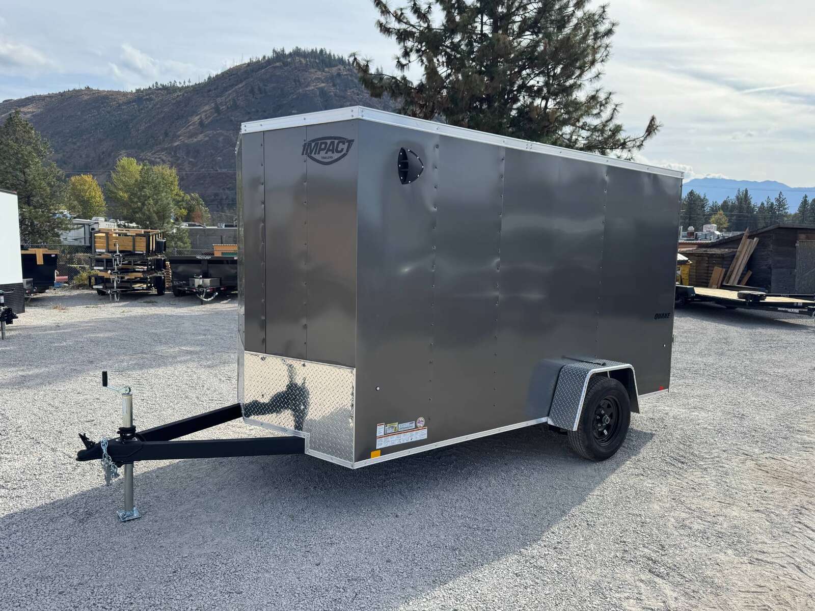 Photo of 2026 Impact Quake 6x12 V Nose Cargo / Enclosed Trailer Charcoal Grey Ramp Door Extra Height 2990lb GVW