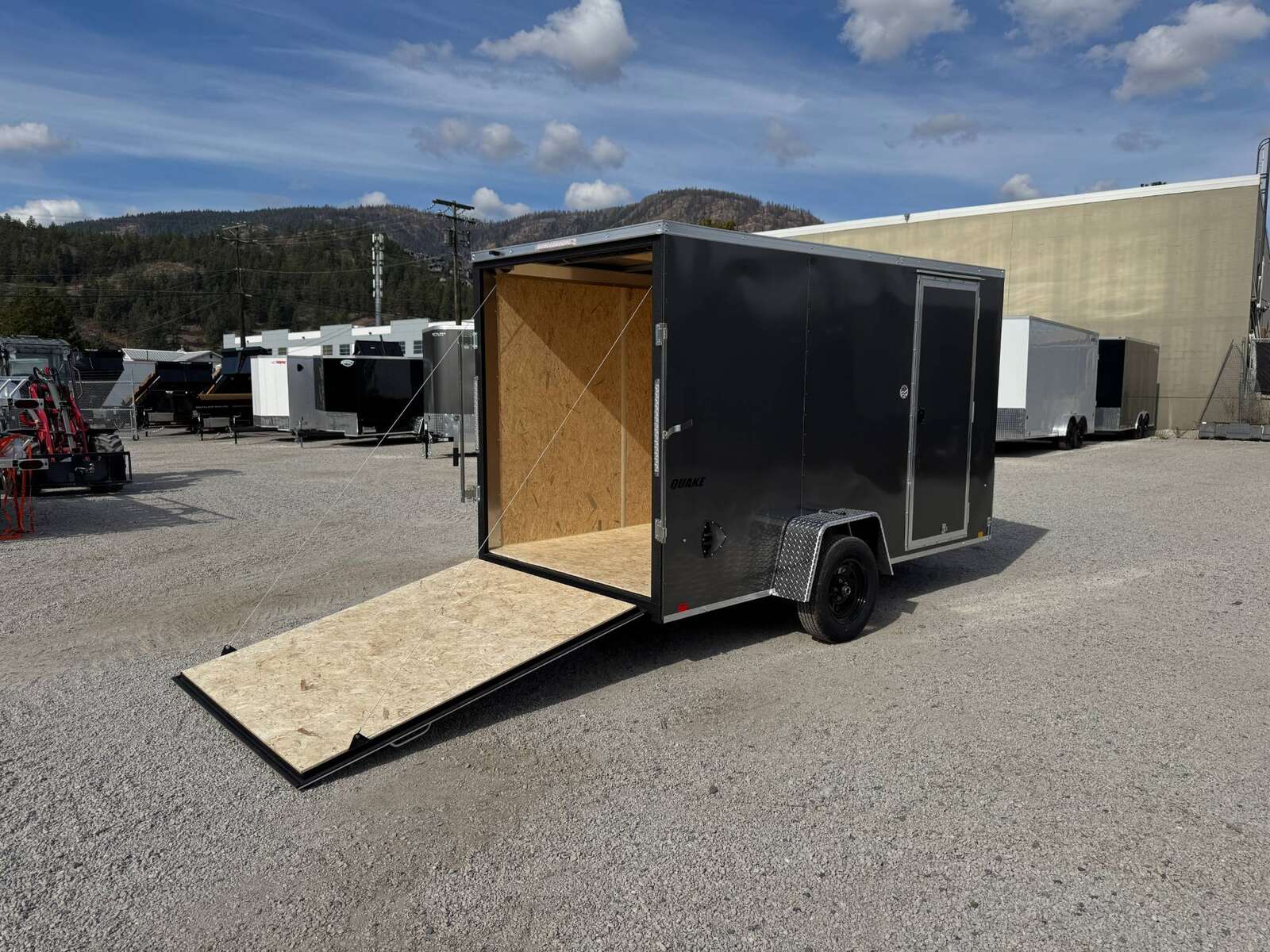 Photo of 2026 Impact Quake 6x12 V Nose Cargo / Enclosed Trailer Charcoal Grey Ramp Door Extra Height 2990lb GVW