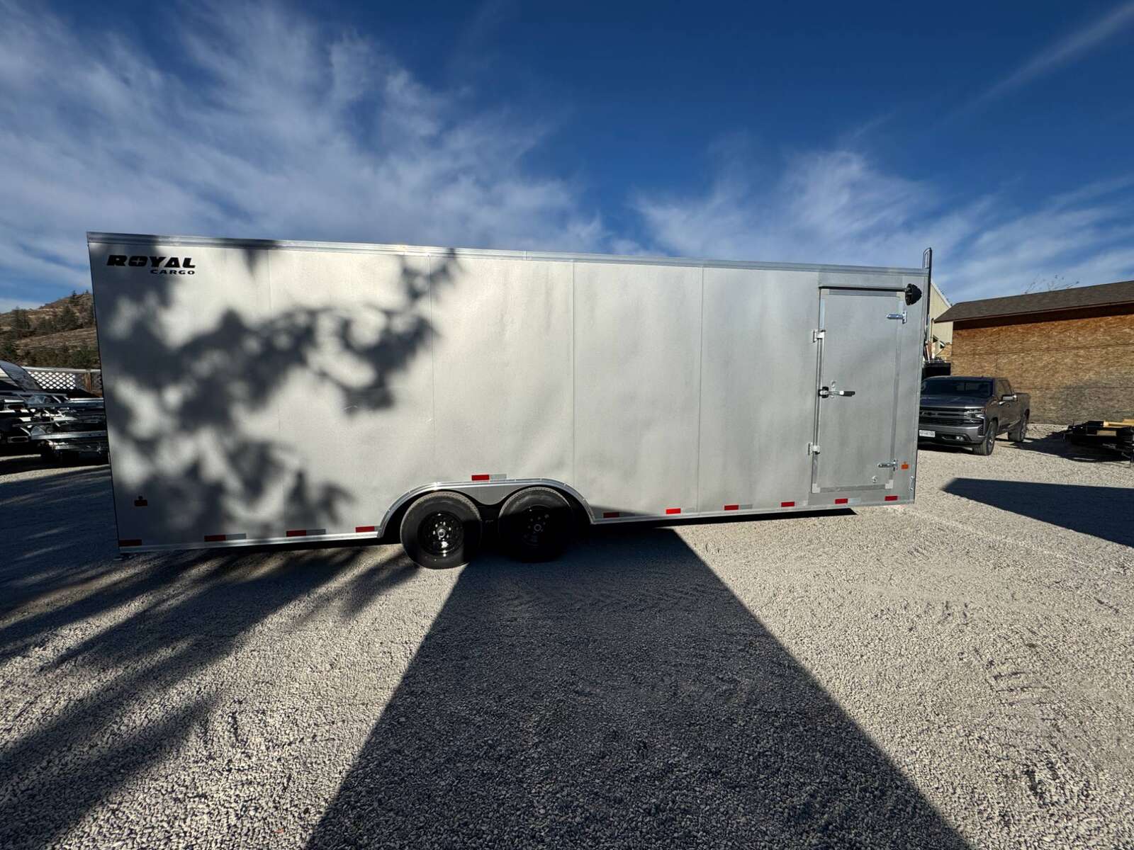 Photo of 2026 Royal Cargo 8.5x24 V Nose Car Hauler Cargo / Enclosed Trailer 11,400lb GVW Silver Ramp Door Extra Height