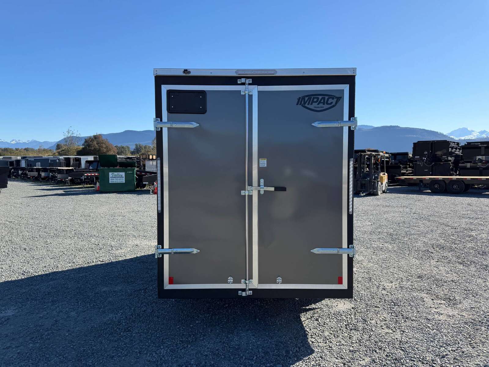 Photo of 2026 Impact Quake 6x12 V Nose Cargo / Enclosed Trailer Charcoal Grey Barn Door Extra Height 2990lb GVW