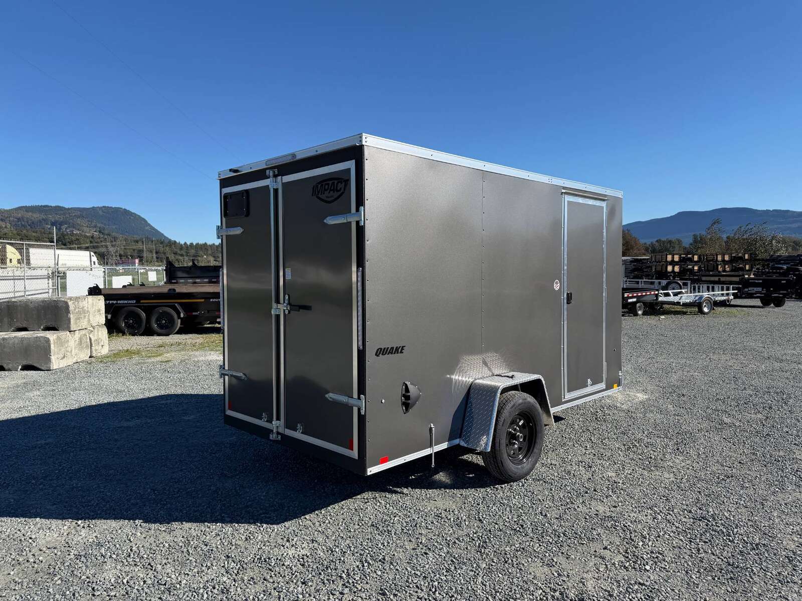 Photo of 2026 Impact Quake 6x12 V Nose Cargo / Enclosed Trailer Charcoal Grey Barn Door Extra Height 2990lb GVW