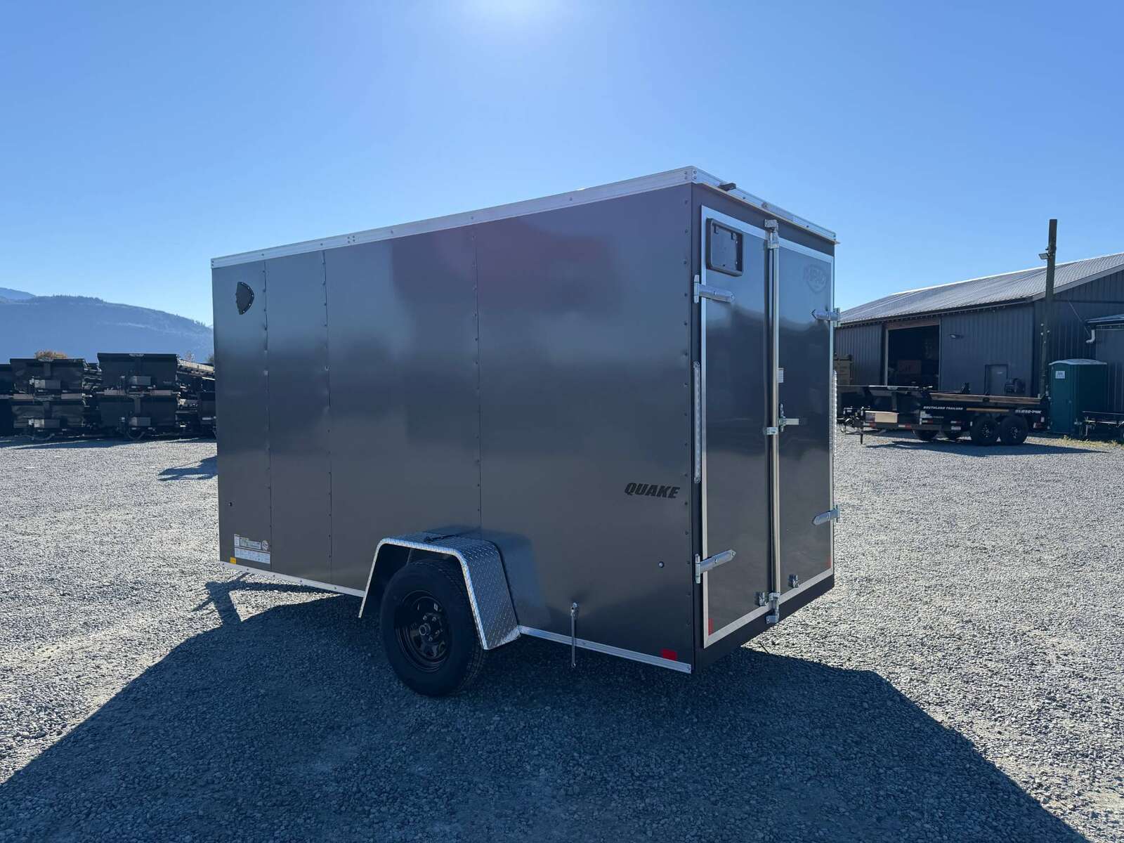 Photo of 2026 Impact Quake 6x12 V Nose Cargo / Enclosed Trailer Charcoal Grey Barn Door Extra Height 2990lb GVW