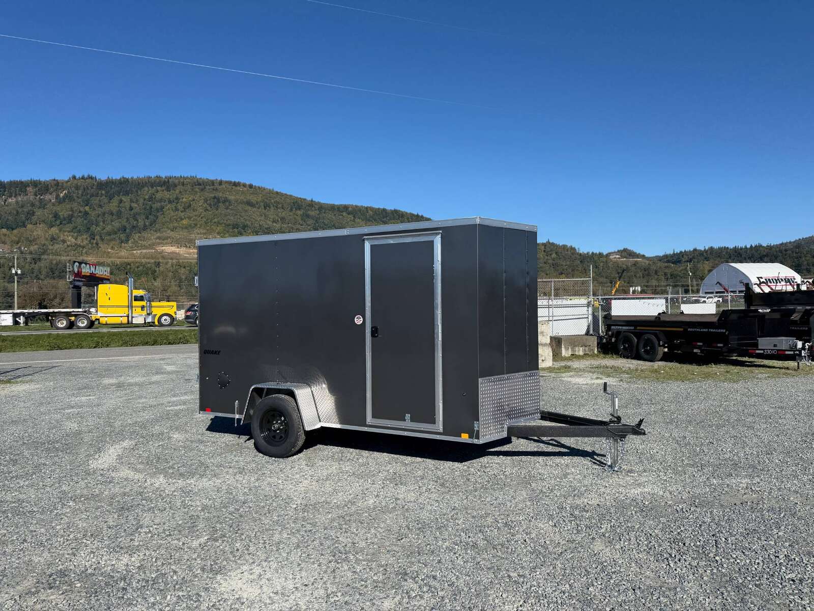 Photo of 2026 Impact Quake 6x12 V Nose Cargo / Enclosed Trailer Charcoal Grey Barn Door Extra Height 2990lb GVW