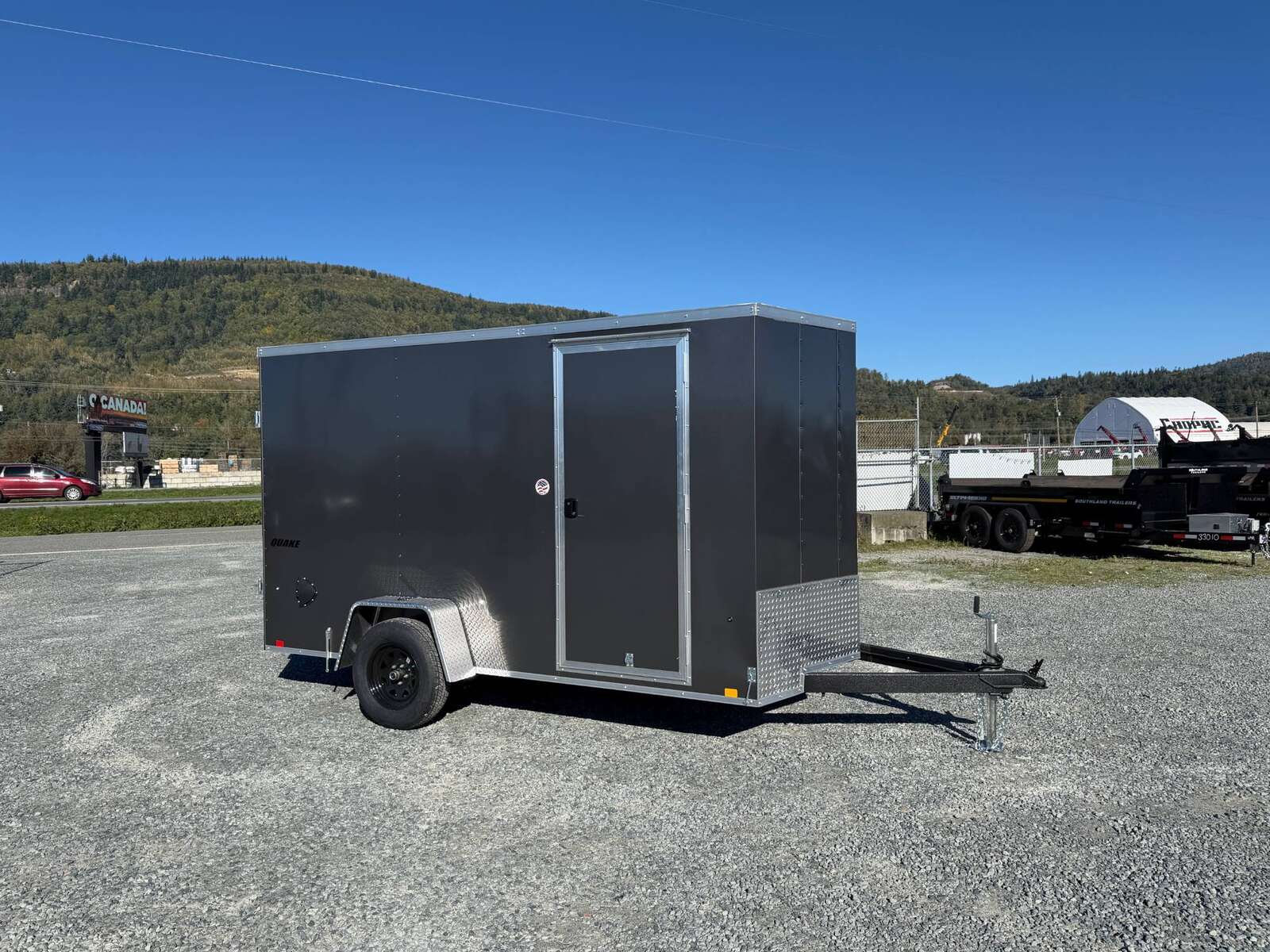 Photo of 2026 Impact Quake 6x12 V Nose Cargo / Enclosed Trailer Charcoal Grey Barn Door Extra Height 2990lb GVW