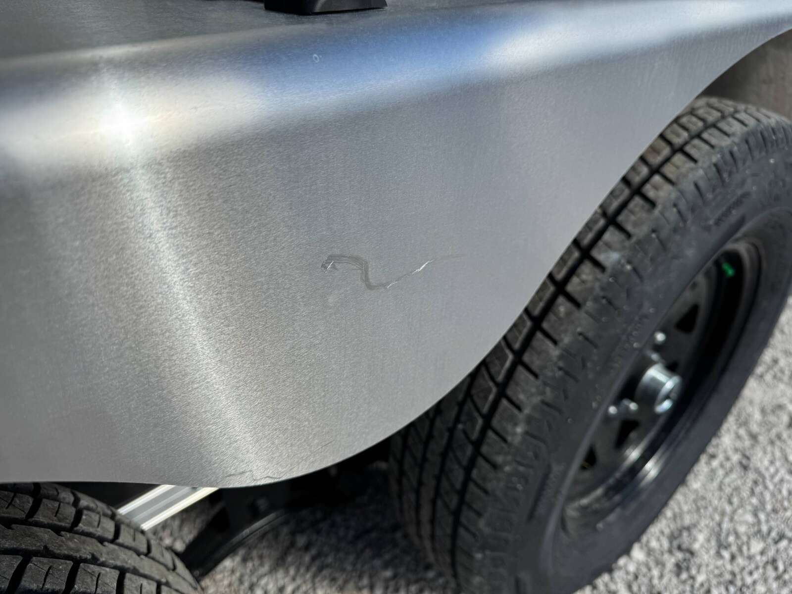 Photo of **Scratch Sale** 2026 Impact 7x14 Quake V Nose Cargo Enclosed Trailer Barn Doors Extra Height Charcoal Grey 7000lb GVW