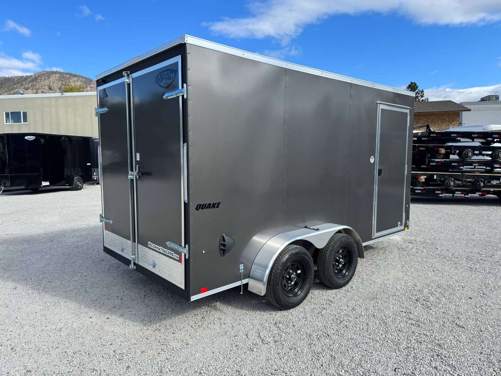 Photo of **Scratch Sale** 2026 Impact 7x14 Quake V Nose Cargo Enclosed Trailer Barn Doors Extra Height Charcoal Grey 7000lb GVW