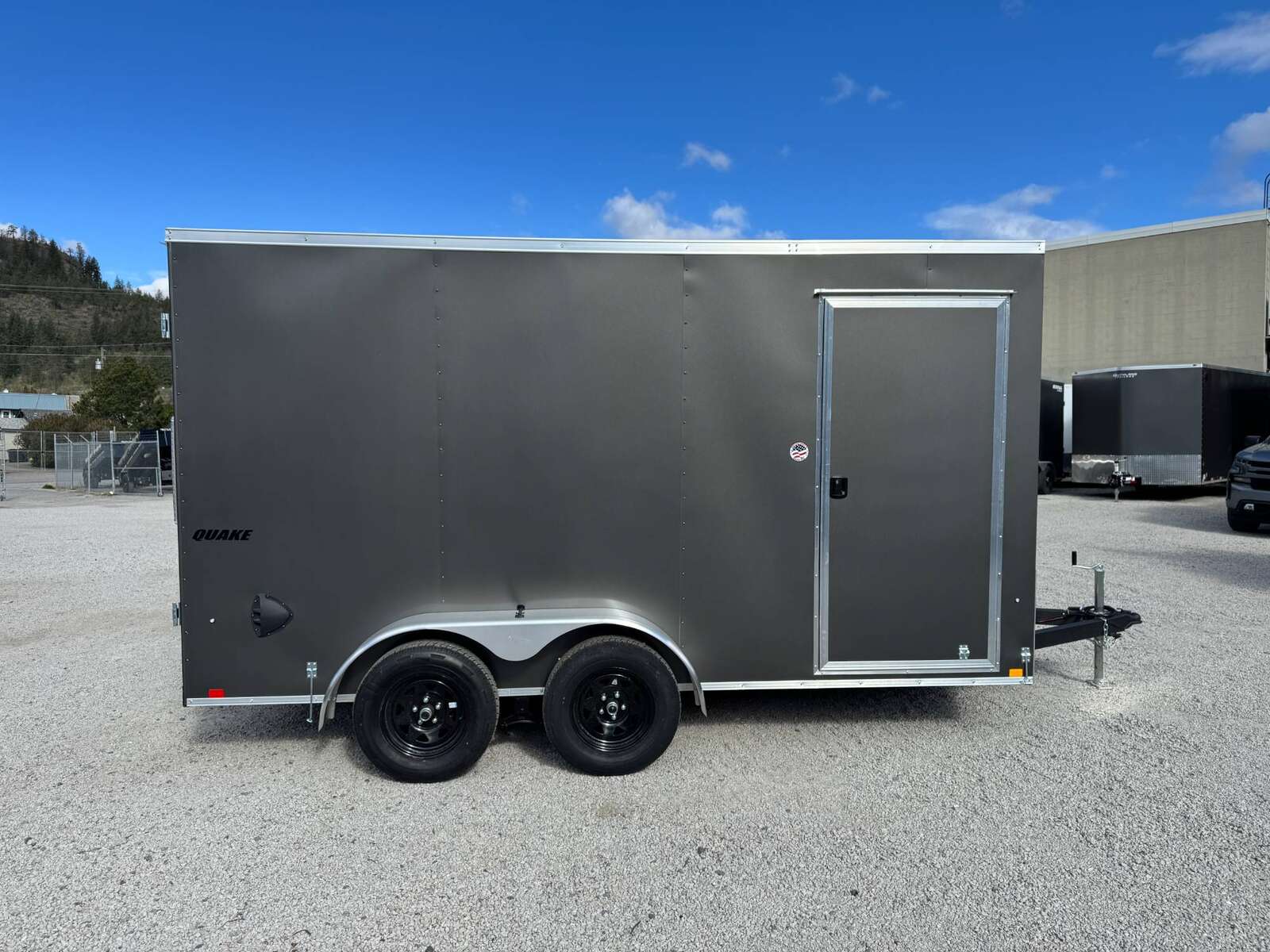 Photo of **Scratch Sale** 2026 Impact 7x14 Quake V Nose Cargo Enclosed Trailer Barn Doors Extra Height Charcoal Grey 7000lb GVW