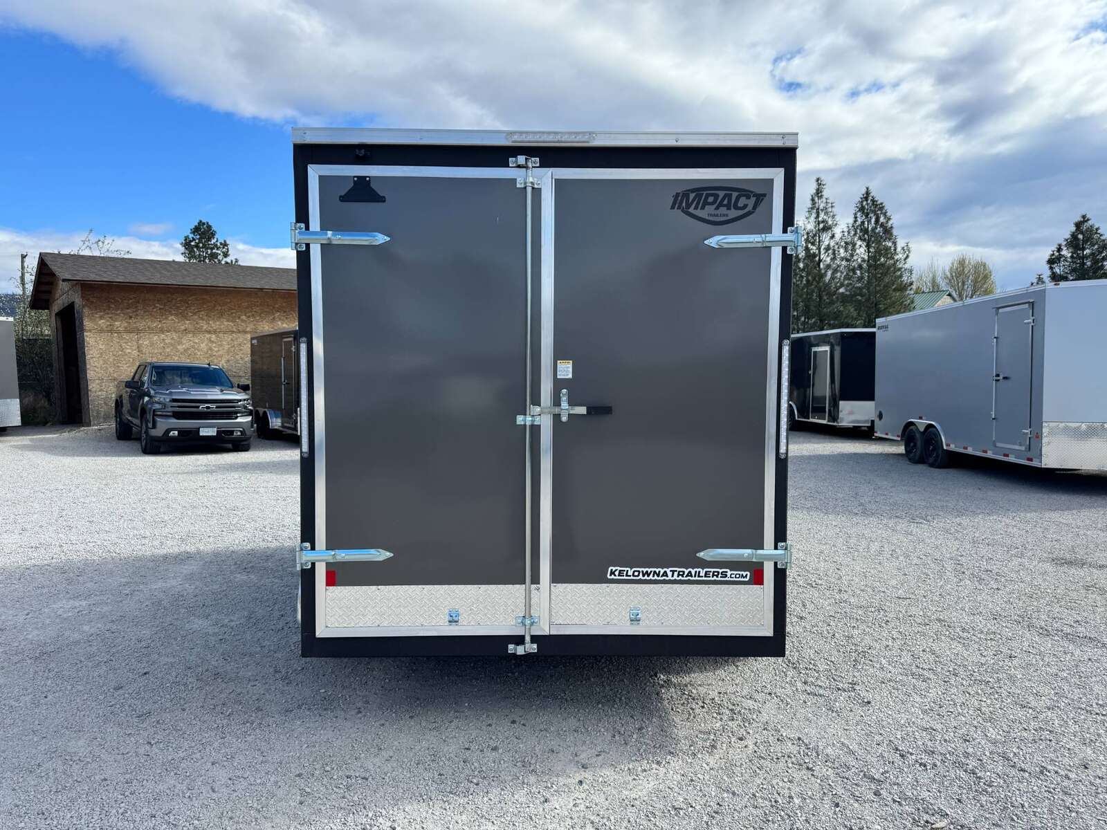 Photo of **Scratch Sale** 2026 Impact 7x14 Quake V Nose Cargo Enclosed Trailer Barn Doors Extra Height Charcoal Grey 7000lb GVW