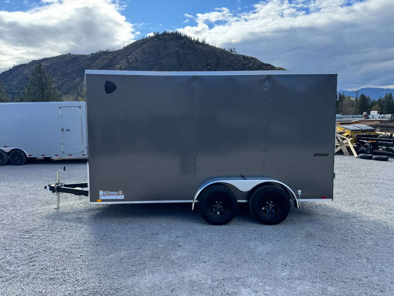 Photo of **Scratch Sale** 2026 Impact 7x14 Quake V Nose Cargo Enclosed Trailer Barn Doors Extra Height Charcoal Grey 7000lb GVW