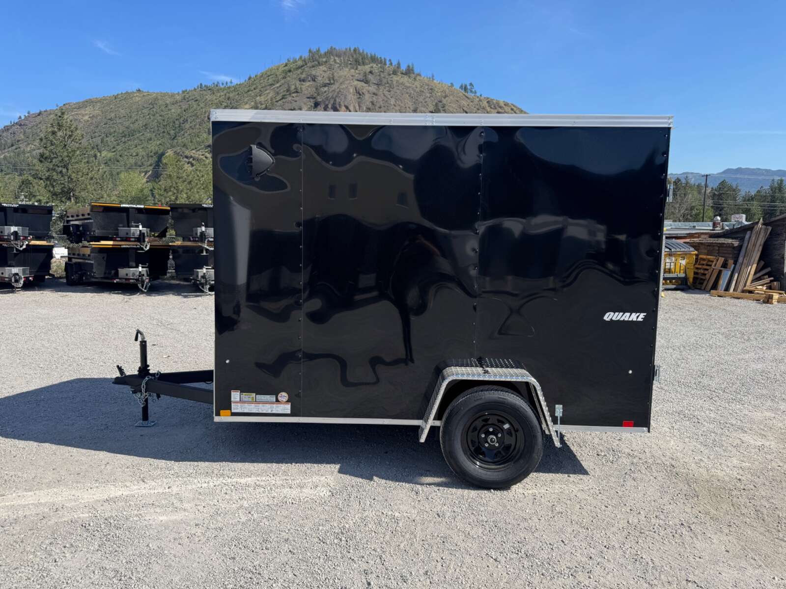 Photo of 2026 Impact Quake 6x10 V Nose Enclosed Cargo Trailer Barn Doors Black Extra Height 2990lb GVW