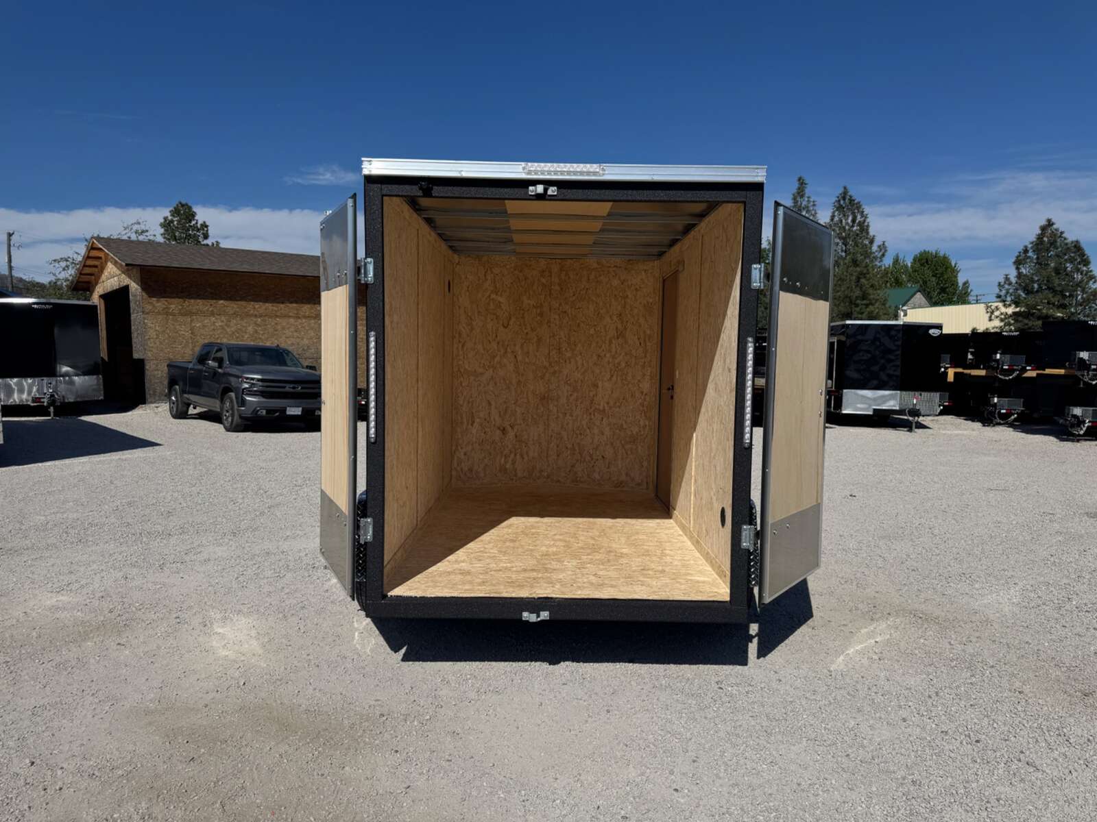 Photo of 2026 Impact Quake 6x10 V Nose Enclosed Cargo Trailer Barn Doors Black Extra Height 2990lb GVW