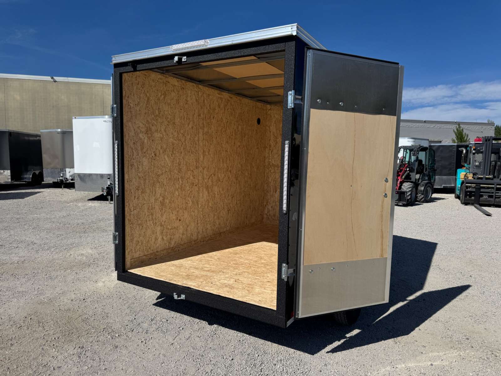 Photo of 2026 Impact Quake 6x10 V Nose Enclosed Cargo Trailer Barn Doors Black Extra Height 2990lb GVW