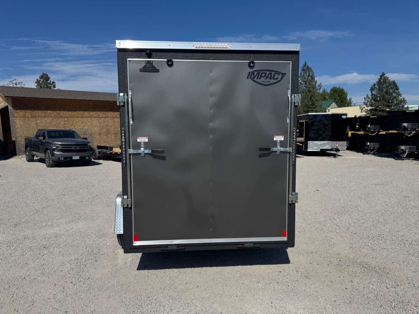 Photo of 2026 Impact Quake 6x10 V Nose Enclosed Cargo Trailer Ramp Door Charcoal Grey Extra Height 2990lb GVW