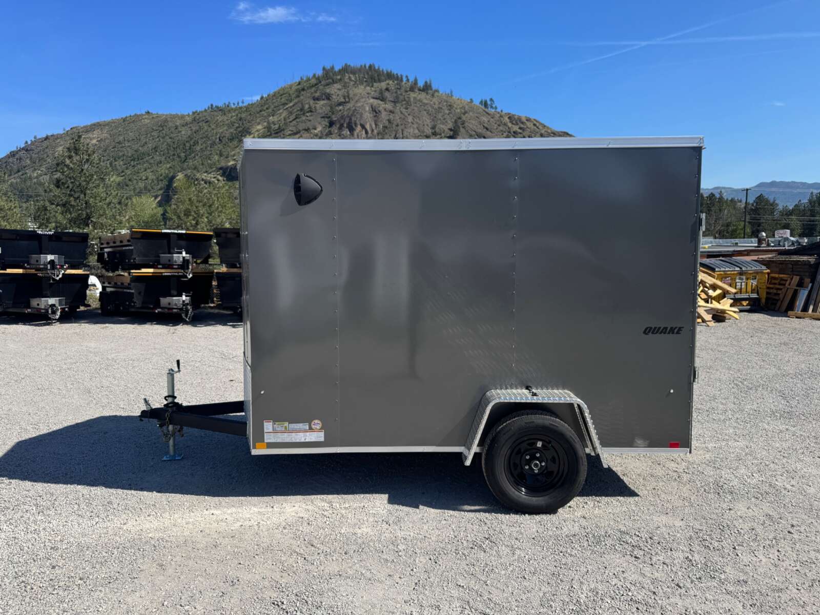 Photo of 2026 Impact Quake 6x10 V Nose Enclosed Cargo Trailer Ramp Door Charcoal Grey Extra Height 2990lb GVW