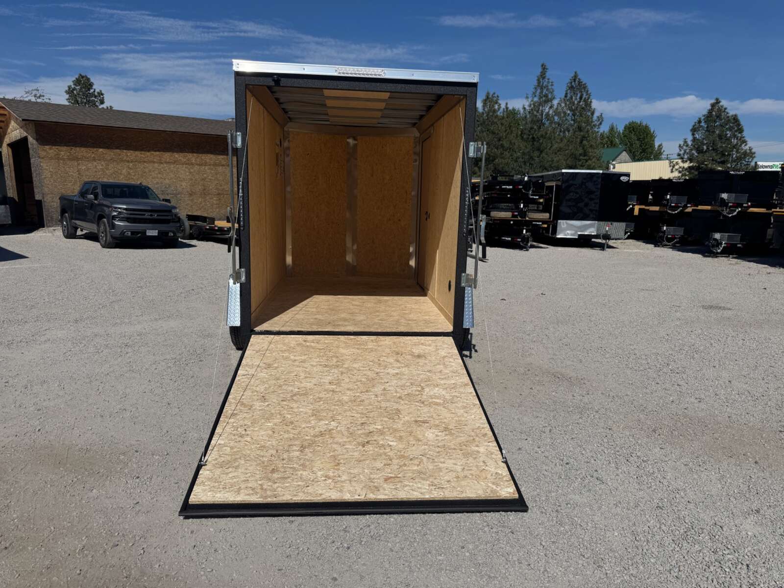 Photo of 2026 Impact Quake 6x10 V Nose Enclosed Cargo Trailer Ramp Door Charcoal Grey Extra Height 2990lb GVW
