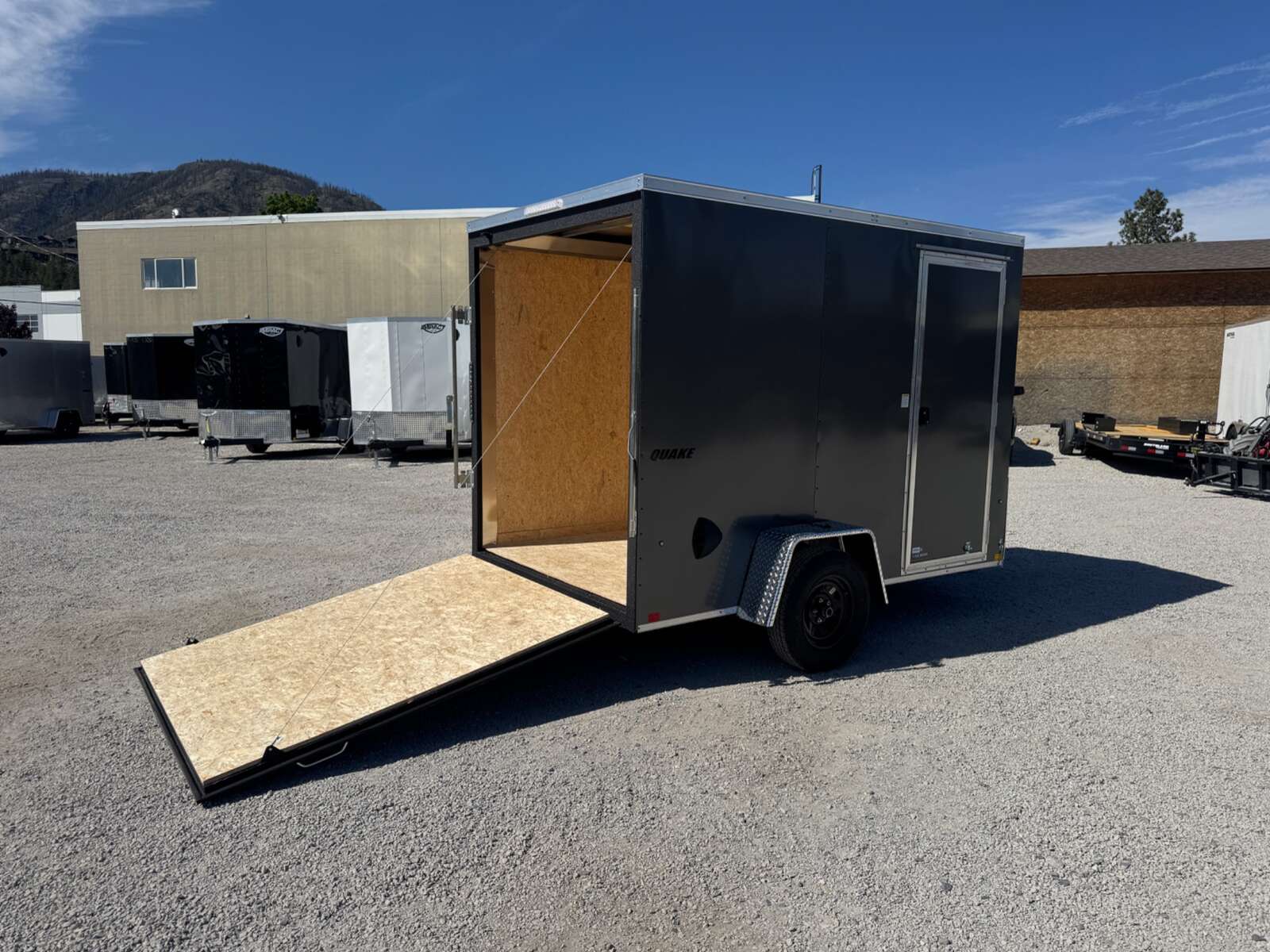 Photo of 2026 Impact Quake 6x10 V Nose Enclosed Cargo Trailer Ramp Door Charcoal Grey Extra Height 2990lb GVW