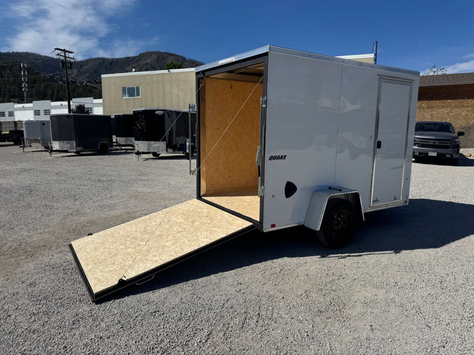 Photo of 2026 Impact Quake 6x10 V Nose Enclosed Cargo Trailer Ramp Door White Extra Height 2990lb GVW