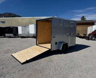 Thumbnail Photo of 2026 Impact Quake 6x10 V Nose Enclosed Cargo Trailer Ramp Door Silver Extra Height 2990lb GVW