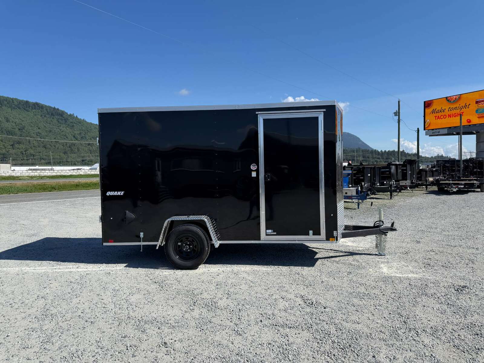 Photo of 2026 Impact Quake 6x12 V Nose Cargo / Enclosed Trailer Black Barn Door Extra Height 2990lb GVW