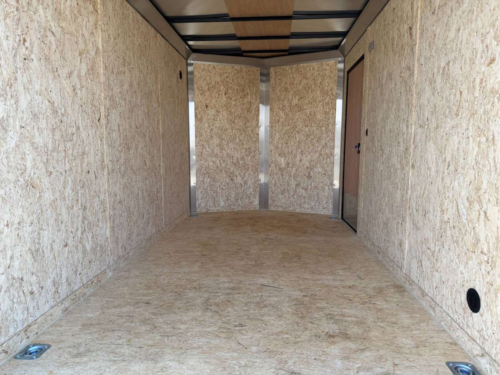 Photo of 2027 Impact Quake 7x12 V Nose Cargo / Enclosed Trailer / Black Polycor Exterior / 5000lb GVW Brake Axle w/ Ramp Door