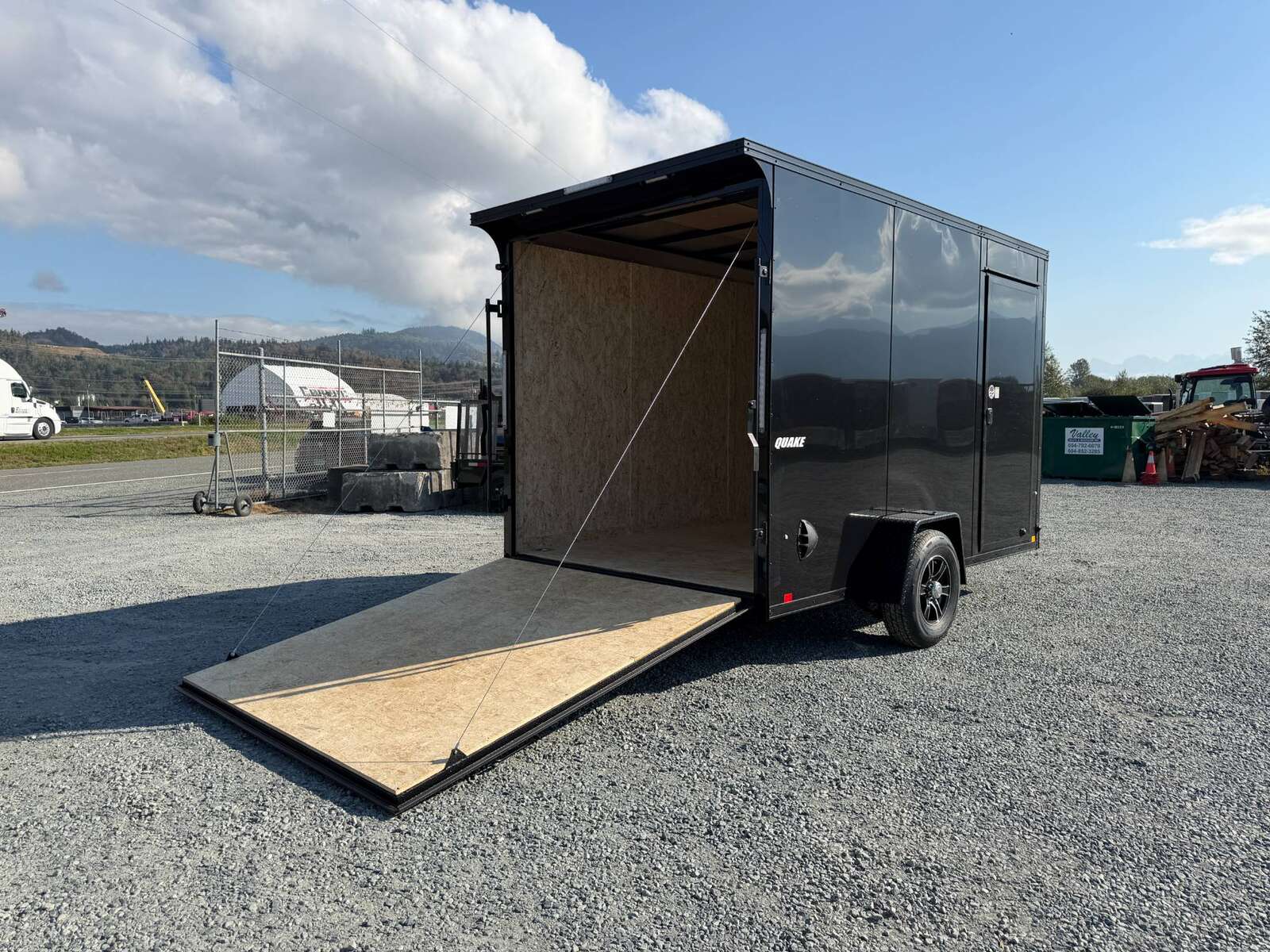 Photo of 2027 Impact Quake 7x12 V Nose Cargo / Enclosed Trailer / Black Polycor Exterior / 5000lb GVW Brake Axle w/ Ramp Door