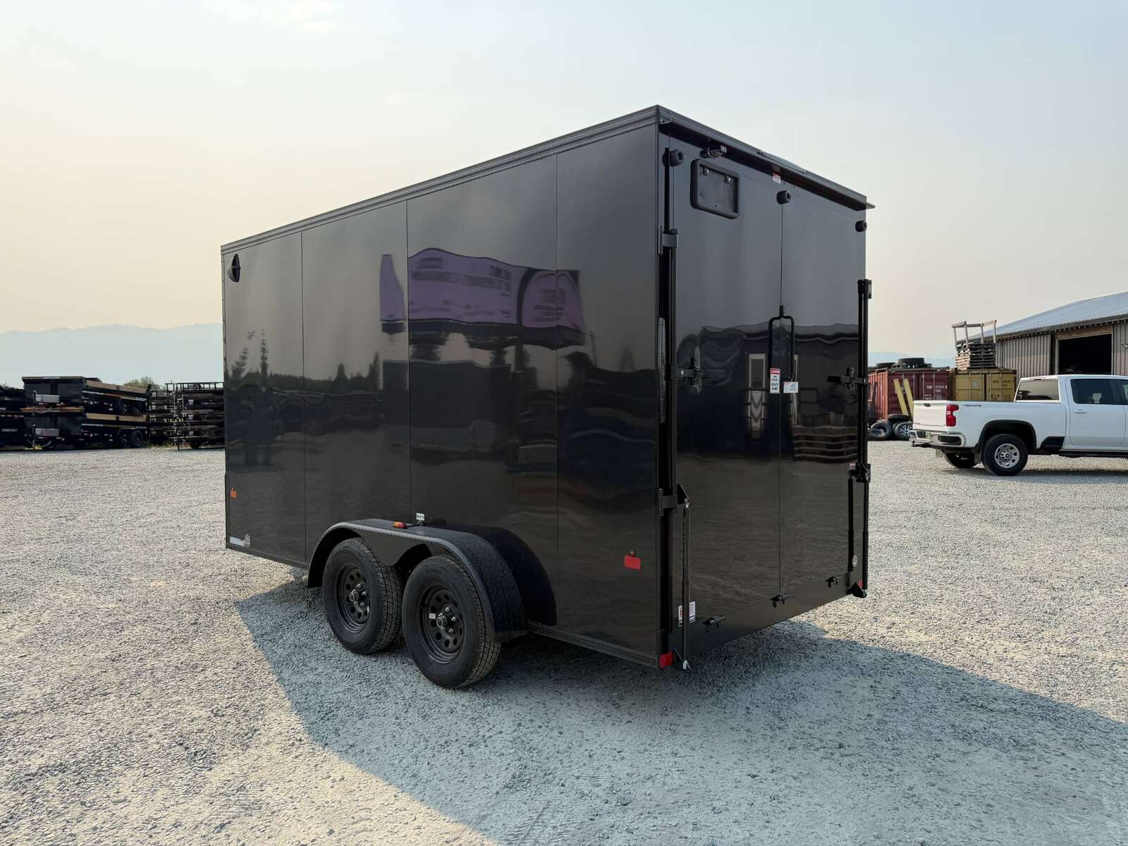 Photo of 2027 Royal Cargo 7X14 V Nose 7700LB GVW RAMP DOOR Black w/ Blackout Package Enclosed Cargo Trailer Extra Tall
