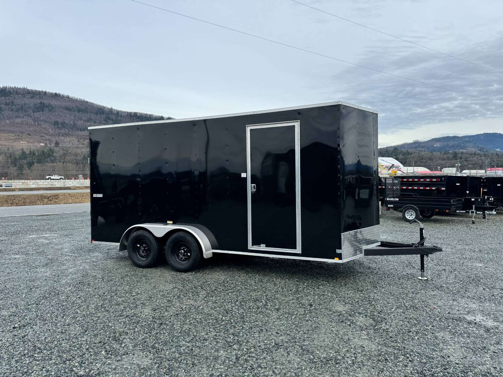 Photo of 2025 Mirage XE 7X16 V-Nose Ramp Door Cargo / Enclosed Trailer Extra Height Black 7000lb GVW