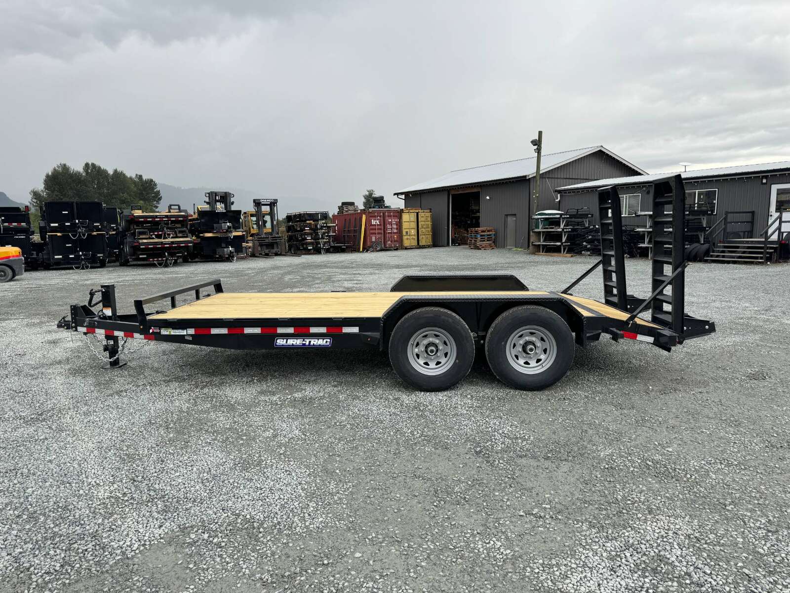 Photo of 2025 Suretrac 7x16 Equipment Trailer 14,000LB GVW Implement Flat Deck w/ Stand Up Ramps
