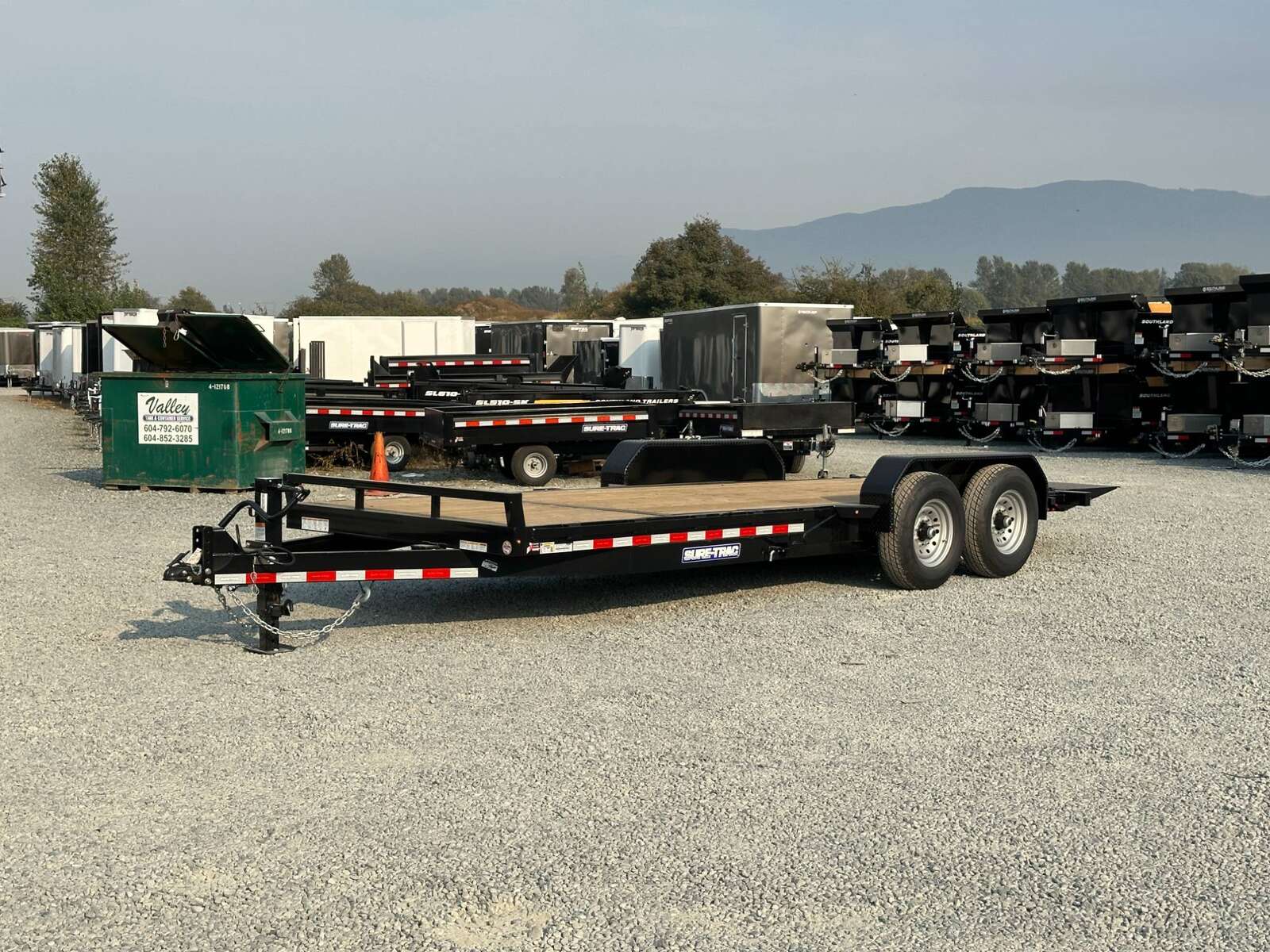 Photo of 2025 Suretrac 7x16+4 HD Tilt Deck Equipment Trailer w/ 4ft Stationary Section 14,000lb GVW