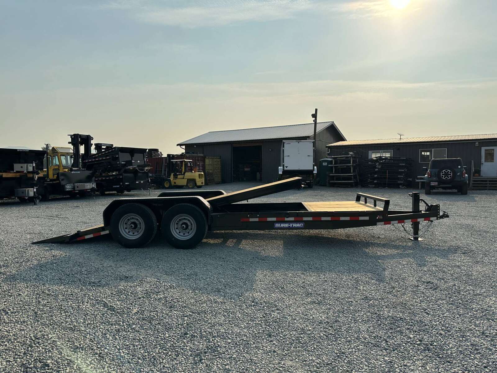 Photo of 2025 Suretrac 7x16+4 HD Tilt Deck Equipment Trailer w/ 4ft Stationary Section 14,000lb GVW